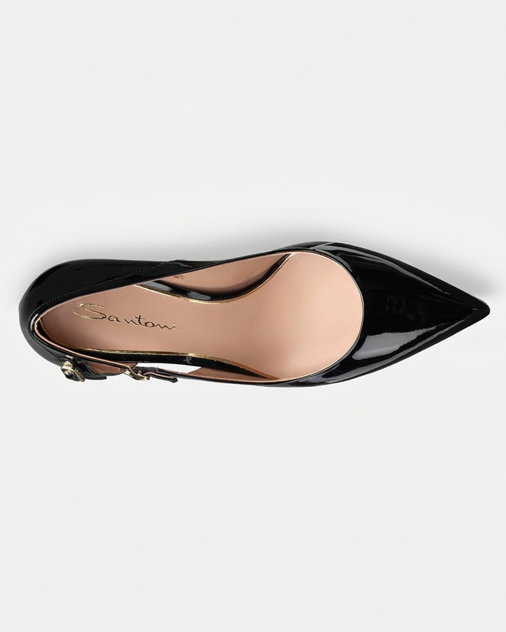 Black patent shoe with an almost-white grey studio background and original square framing