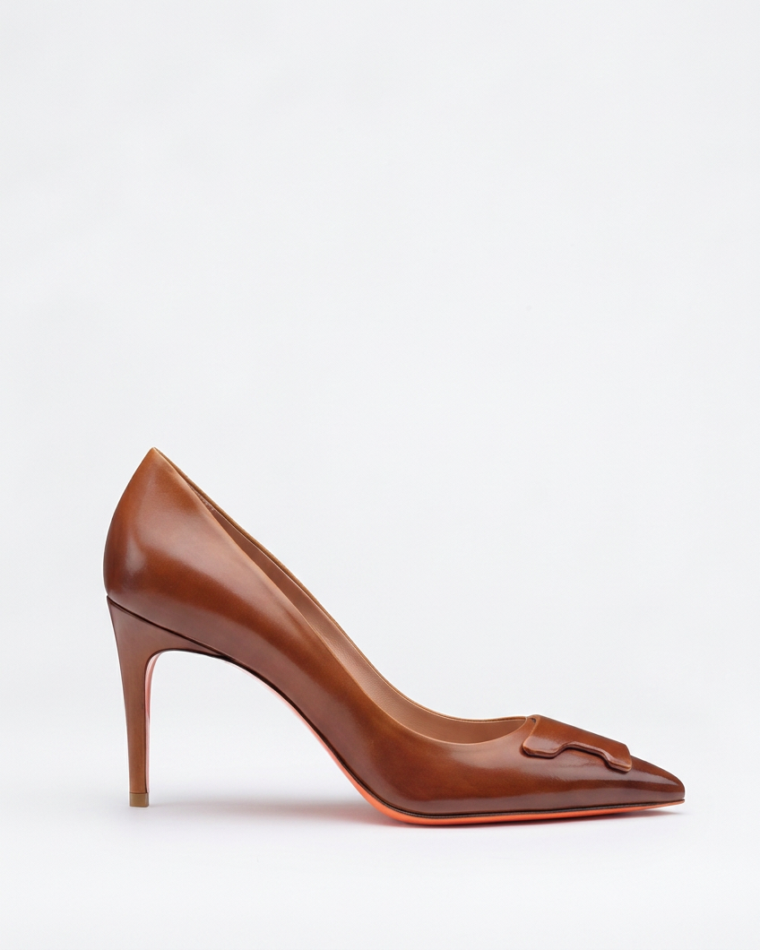 Brown patent pump swapped onto the existing pale background at the same low baseline