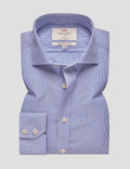 A folded light blue and white micro-geometric striped dress shirt by Smith & Taylor, featuring a pointed collar, button-down front, and a double-button cuff, displayed on a neutral gray background.