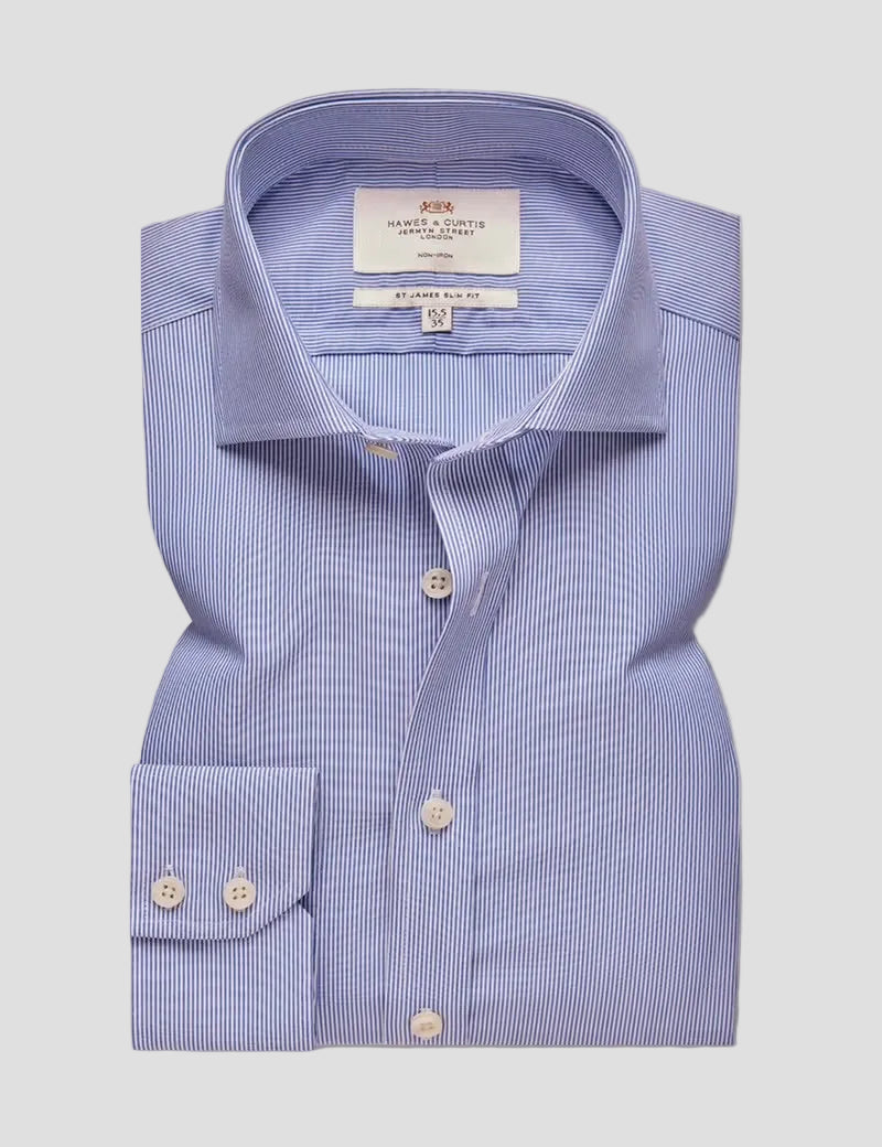 A folded light blue and white micro-geometric striped dress shirt by Smith & Taylor, featuring a pointed collar, button-down front, and a double-button cuff, displayed on a neutral gray background.