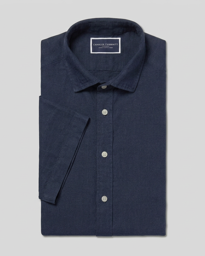 Navy shirt preview with a flattened diagonal sleeve in landscape format
