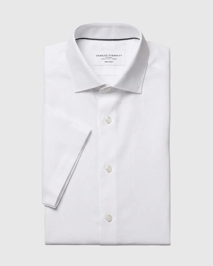 White shirt edit with closed buttons, flat diagonal sleeves and a requested 5:4 landscape frame